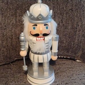 Christmas King nutcracker. Silver and white color. 9 1/2 " tall